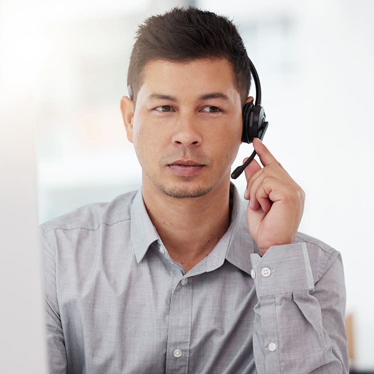 Receptionist answering call over headphone